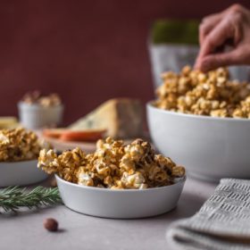 Candied rosemary popcorn with hazelnuts in a 3 bowls